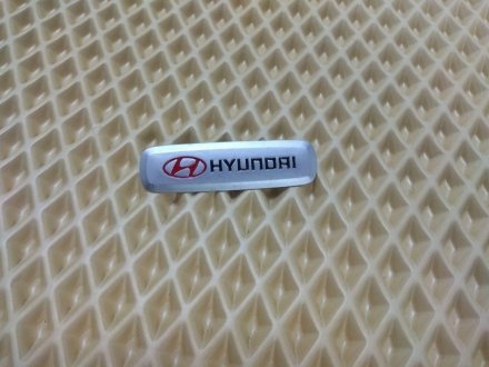 Шильдик (эмблема) для ковриков Hyundai AVTM LGEV10264 (фото 1)